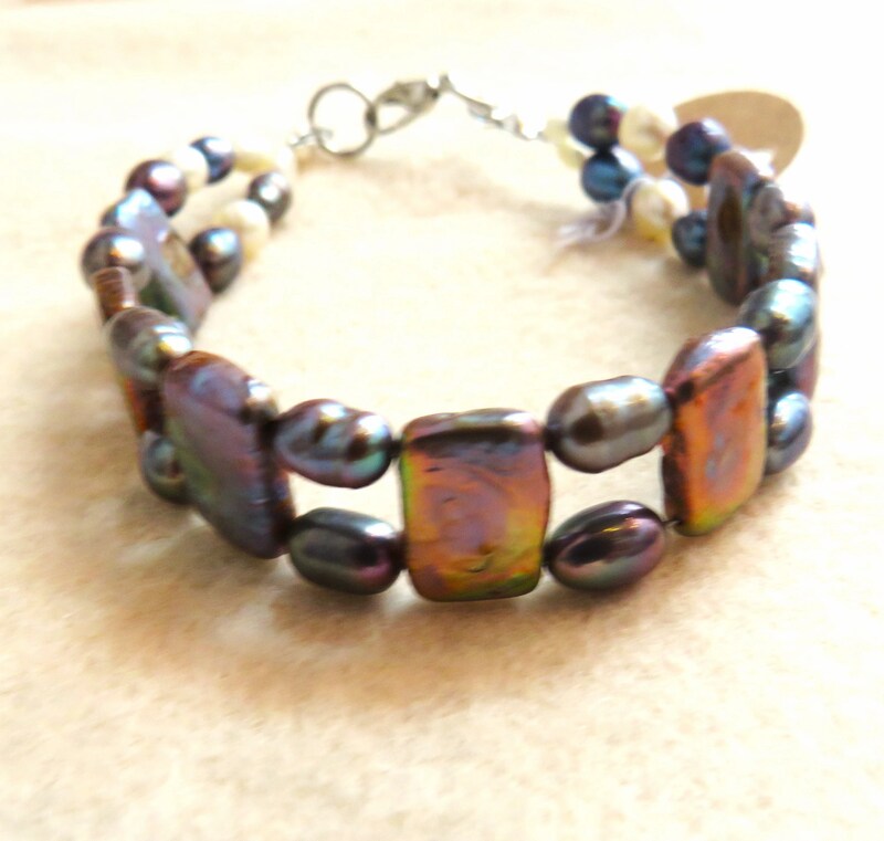 Double-stranded bracelet with alternating oval and rectangular multi-colored pearl beads